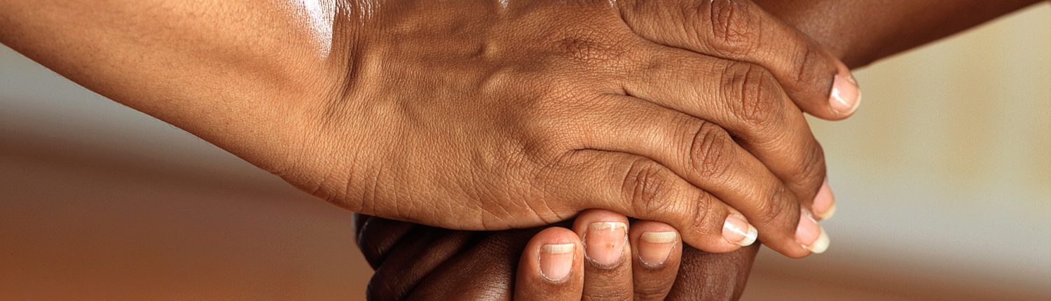 Two people holding hands
